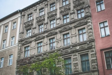 unsanitary old building facade - apartment building exterior Berlin clipart