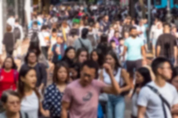 Abstract, blurred concept image of  people walking on crowded st — Stockfoto