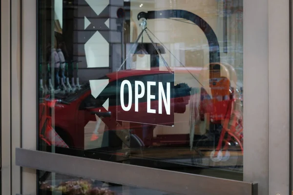 we are open sign on shop door - store window with open sign -