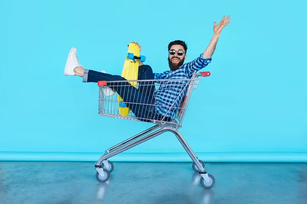 young man in shopping cart