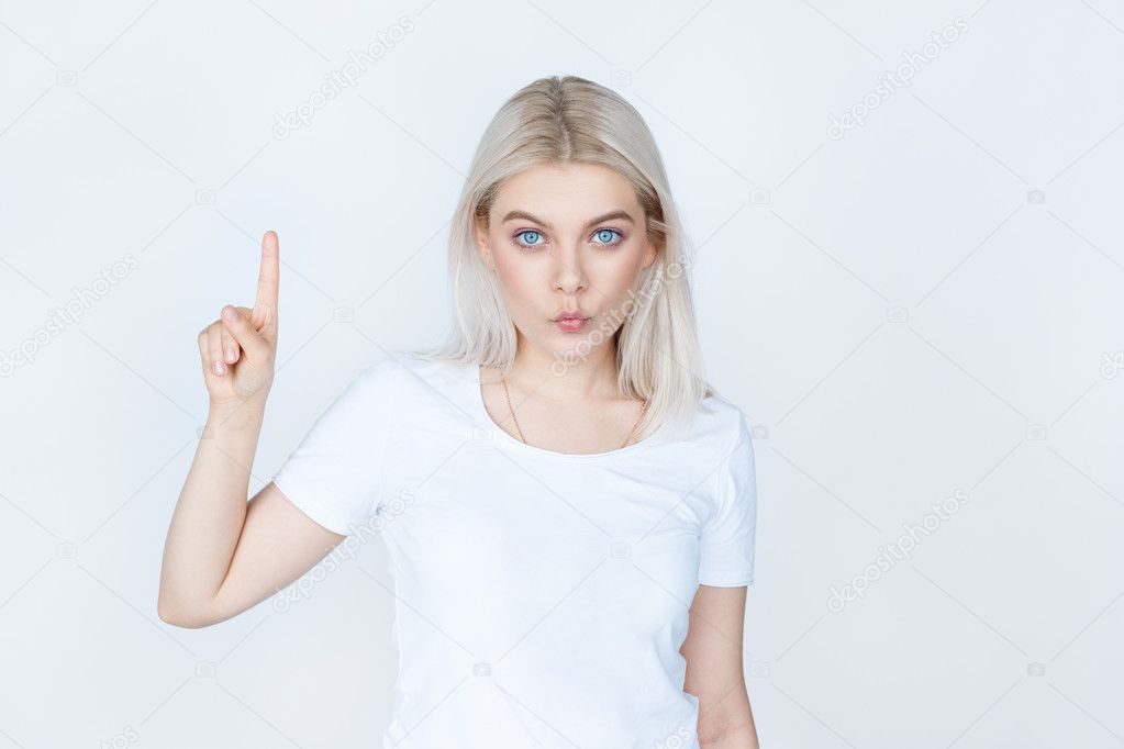 blond female pointing up over white background