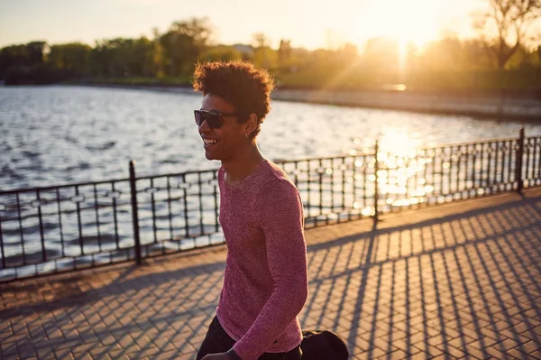 Man in trendy clothes walking in morning — Stock Photo, Image