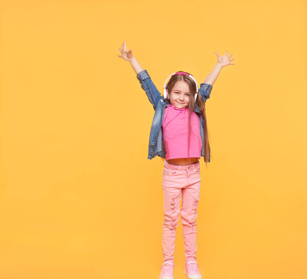 Happy modern kid with hands up