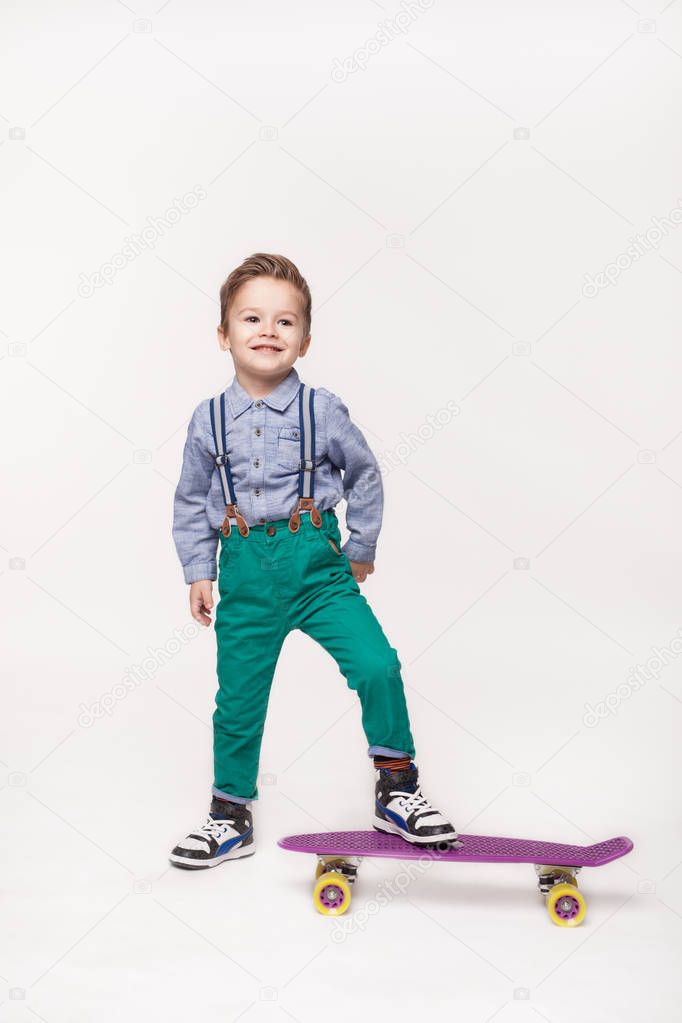 Young skater kid boy isolated on white