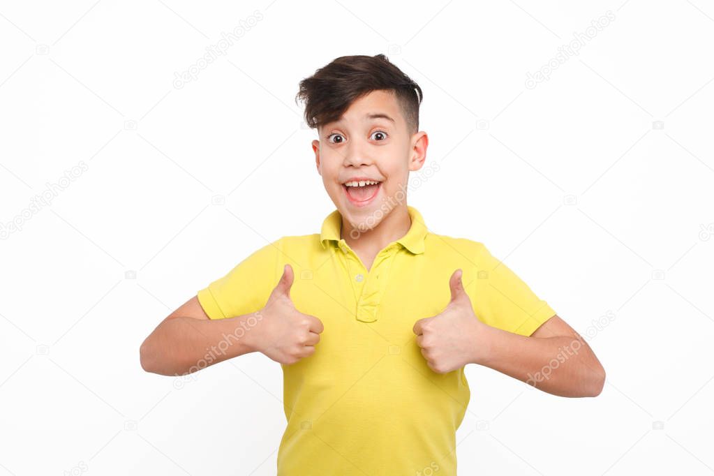 Smiling boy gesturing thumbs up