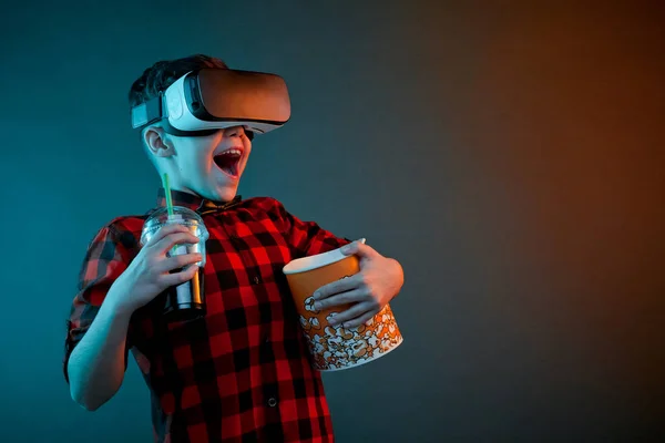 Cheerful boy with popcorn in VR headset — Stock Photo, Image