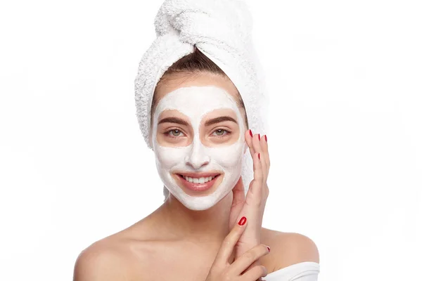 Young woman applying mask — Stock Photo, Image