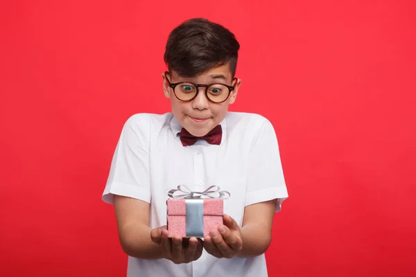 Content boy holding small giftbox — Stock Photo, Image