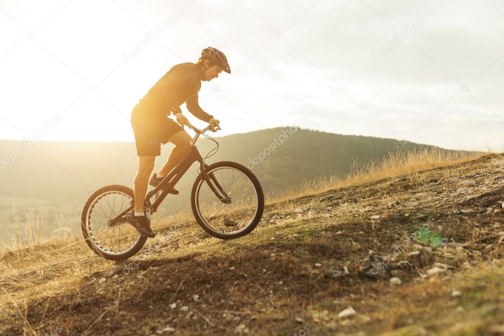 Man in back lit riding bicycle