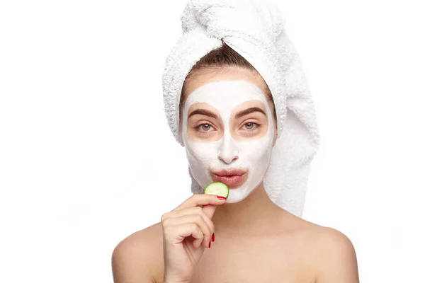 Girl holding a cucumber piece — Stock Photo, Image