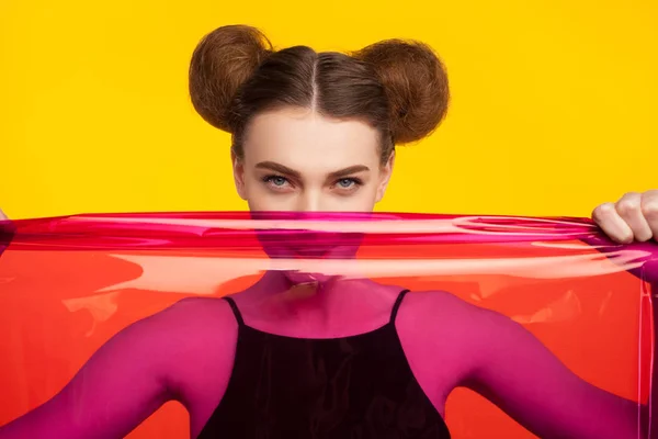 Girl holding piece of  plastic fabric — Stock Photo, Image