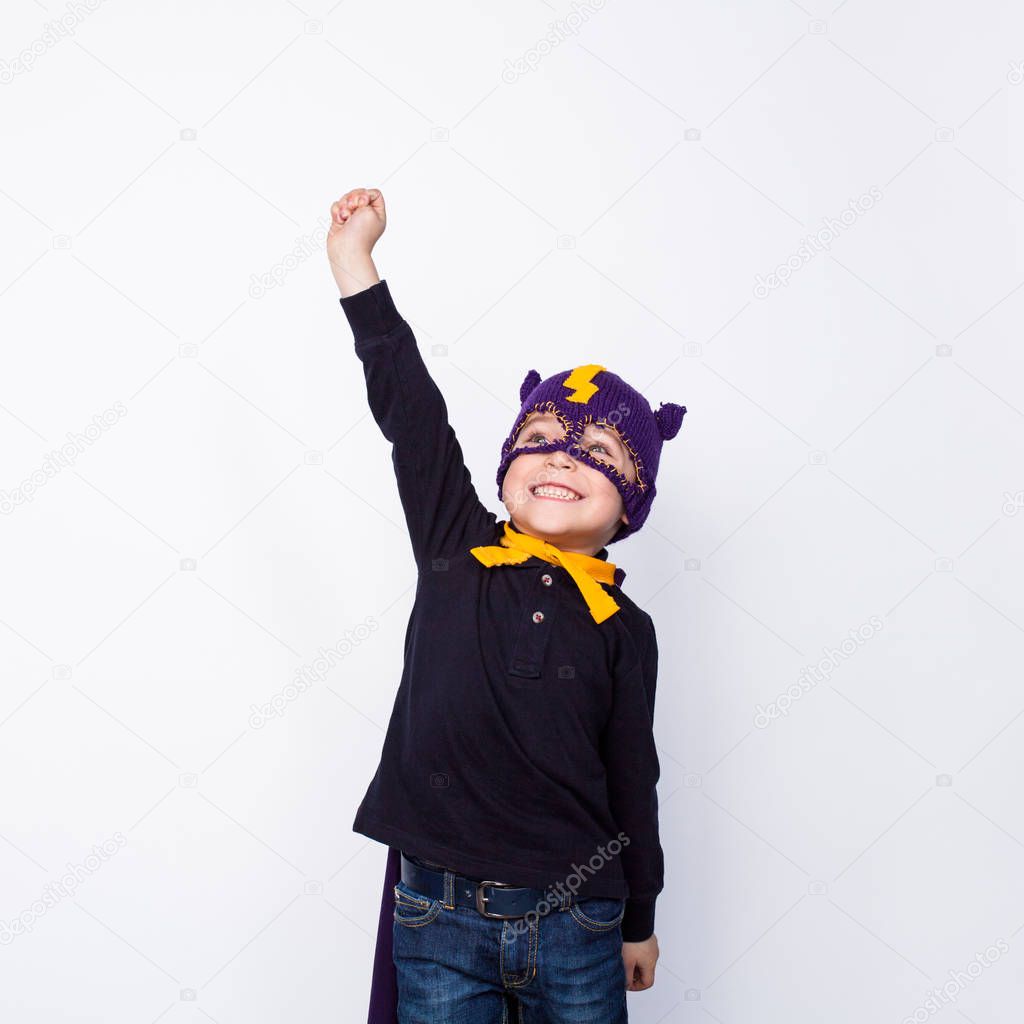 Boy in hero hat posing