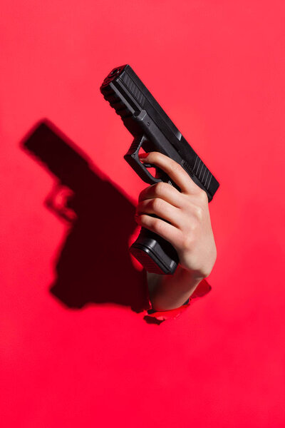 Hand holding pistol gun