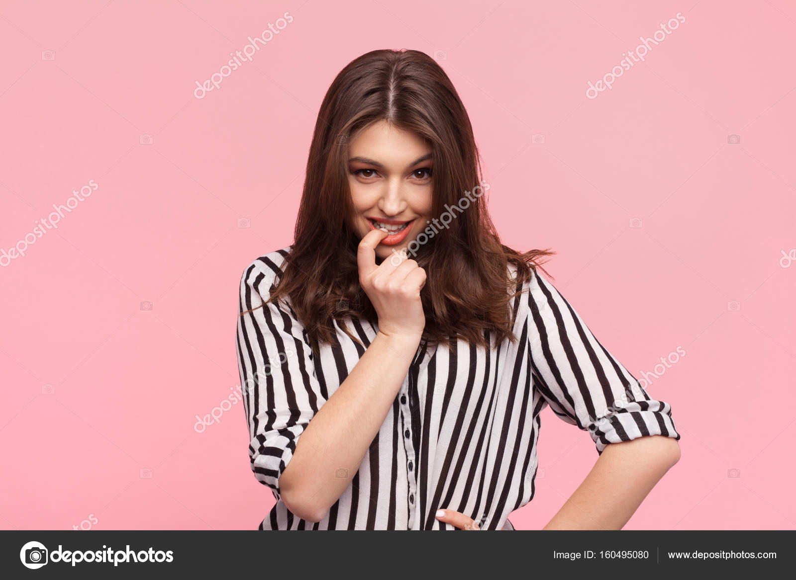 Flirty woman posing on pink Stock Photo by ©kegfire 160495080