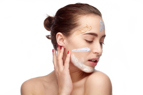 Sensual model with creams on face