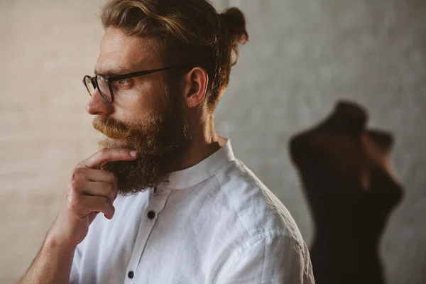 stock image Bearded man wearing glasses touching chin