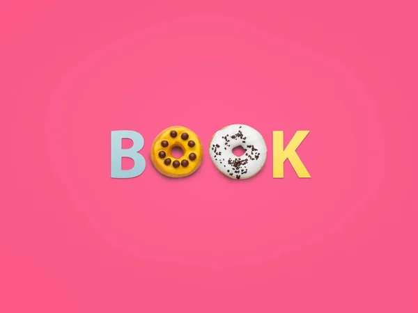 Word Book made with doughnuts — Stock Photo, Image