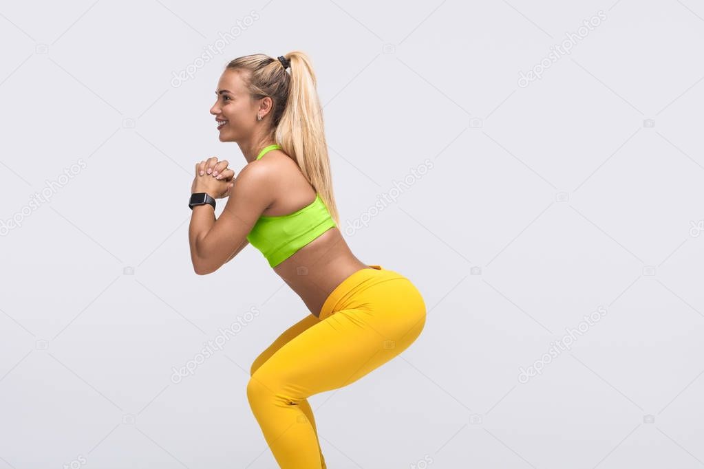 Content woman doing squats