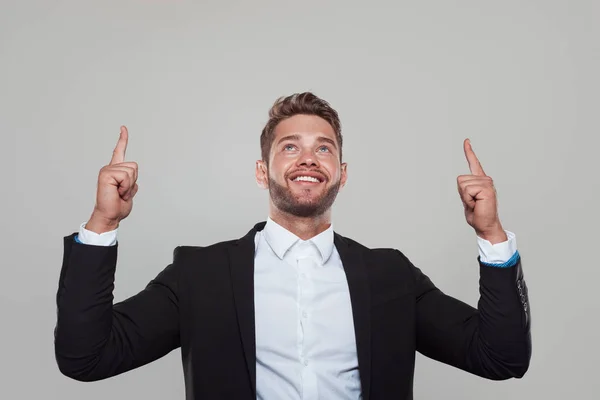 Content businessman pointing up — Stock Photo, Image