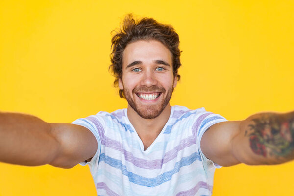 Smiling man taking selfie