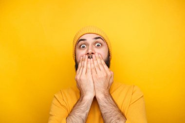 Frightened man in yellow clothes clipart