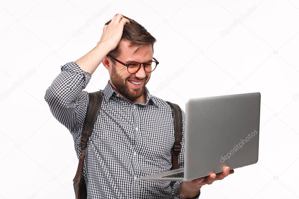 Confused guy with laptop on white