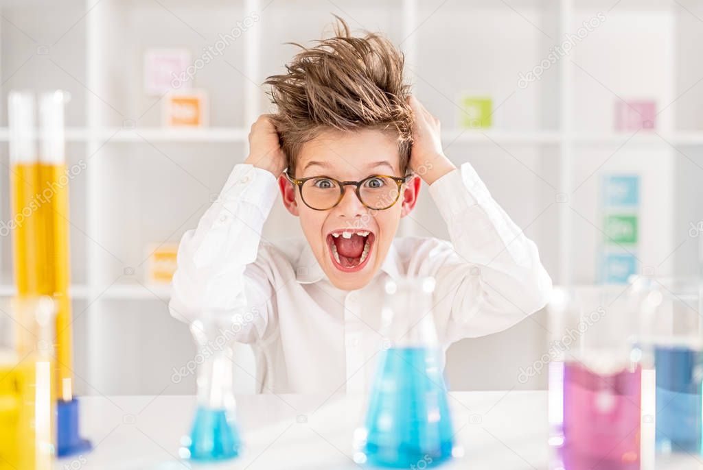 Mad little scientist screaming in lab