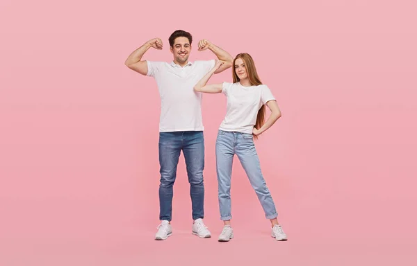 Happy couple showing power gesture