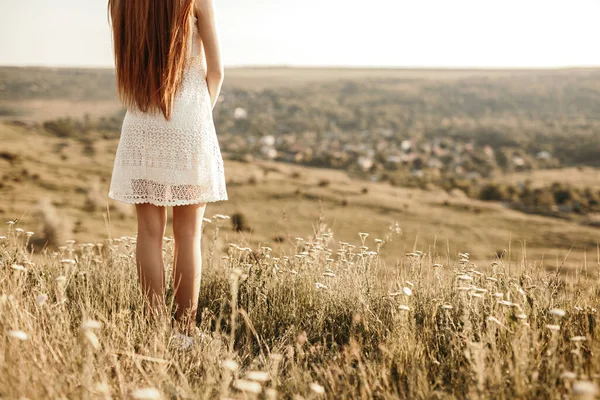 Lonely teen girl standing in field — Stock Photo, Image