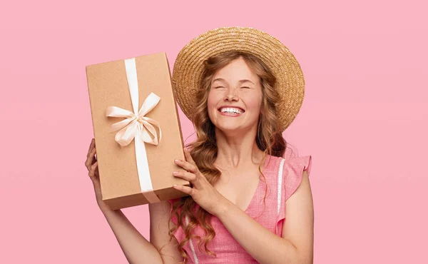 Delighted young woman enjoying present — Stock Photo, Image