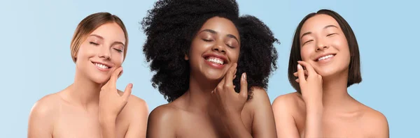 Femmes multiethniques optimistes appliquant de la crème sur le visage — Photo