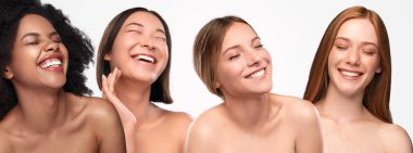 Multiethnic young women laughing with closed eyes