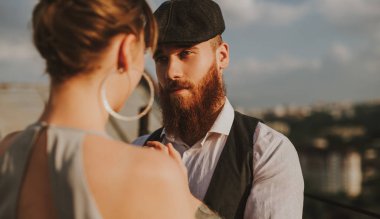 Bearded man during romantic date with girlfriend