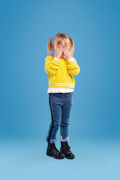 Little girl hiding face with hands — Stock Photo, Image