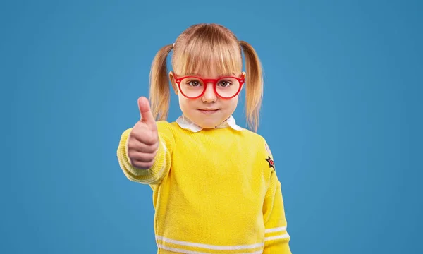 Positive little girl showing thumb up — Stock Photo, Image