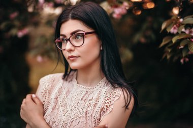 Smart lady resting in garden