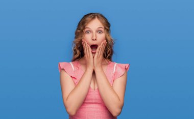 Young woman screaming in shock