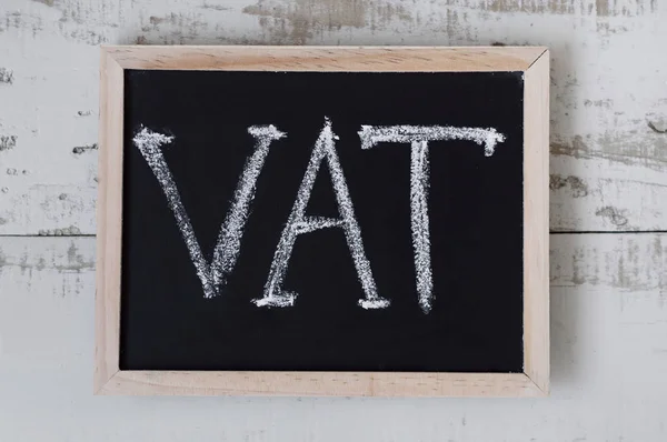 VAT. Value added tax. Blackboard with handwritten text \