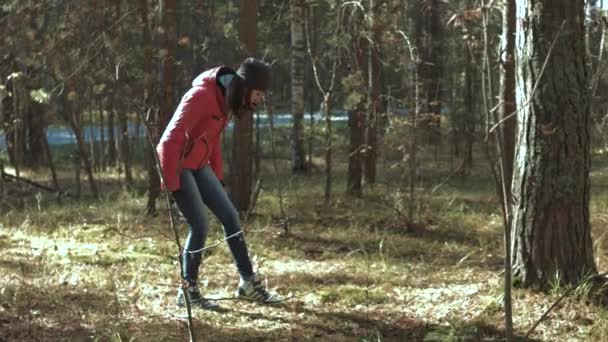 Girl walking on autumn forest — Stockvideo