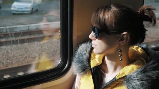 Sad girl on a train — Stockvideo