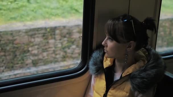 Sad girl on a train — ストック動画