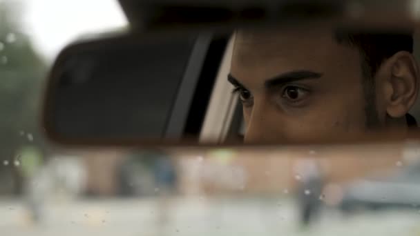 Young Guy Looking Rearview Mirror Sitting Car — Stock Video