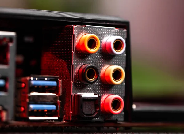 Computer audio and video card connectors close up with red backlight