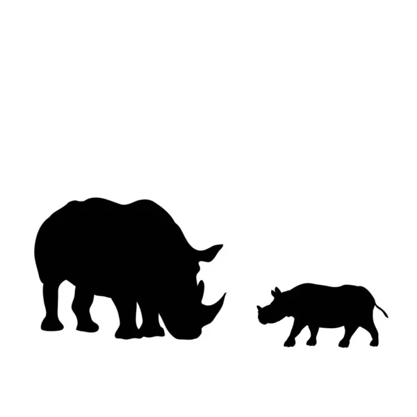 Silhouette von Nashorn und jungen kleinen Nashörnern — Stockvektor