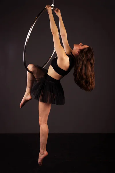 Woman exercising on lyra — Stock Photo, Image