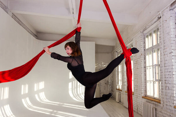 Girl training on aerial silks