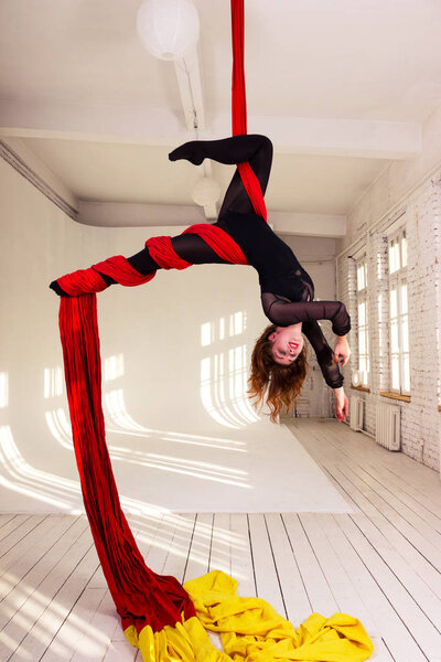 Girl training on aerial silks