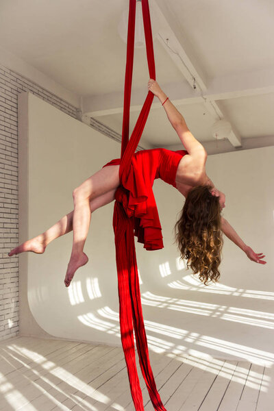 Girl training on aerial silks