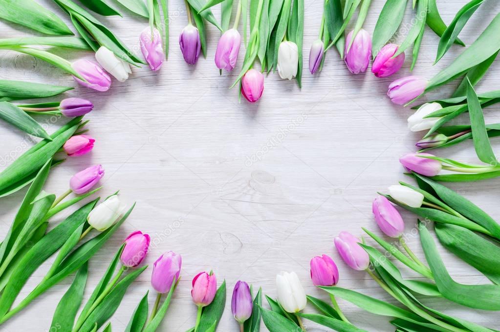 Heart from Tulips Flowers on rustic table for March 8, Internati