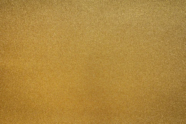 Fine Detailed texture of glittering golden dust surface